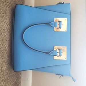 Blue and gold hand bag